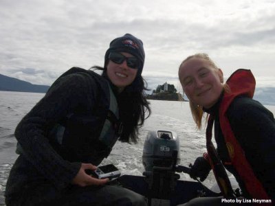 Kat and a friend smiling on a boat